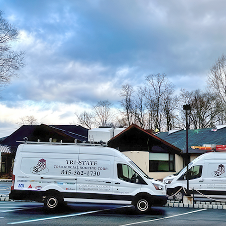 Commercial roofing service trucks parking